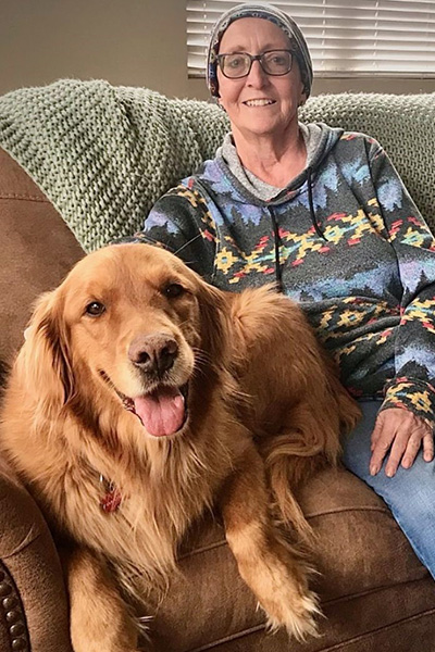 Cancer Survivor and her golden retriever.