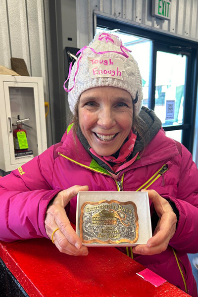 GT cancer survivor of the year shows off her buckle at Pink in the Rink.